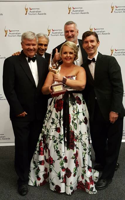 WINNERS: Mount Isa Rotary Rodeo committee collect the award in Darwin: Kim Kretschmann, Paul Silva, Darren Campi, Peter Gogsch and holding the award Natalie Flecker (rodeo manager).