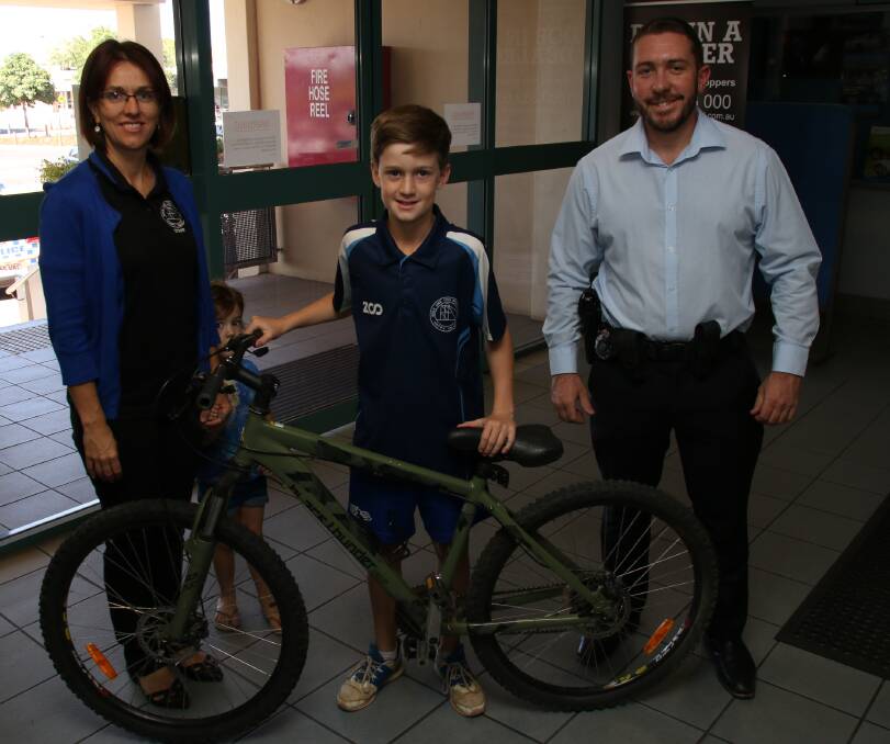 LOCATED: Mount Isa Detectives reunite an owner with a bike, recently seized during an ongoing property operation. (Photo: QPS)