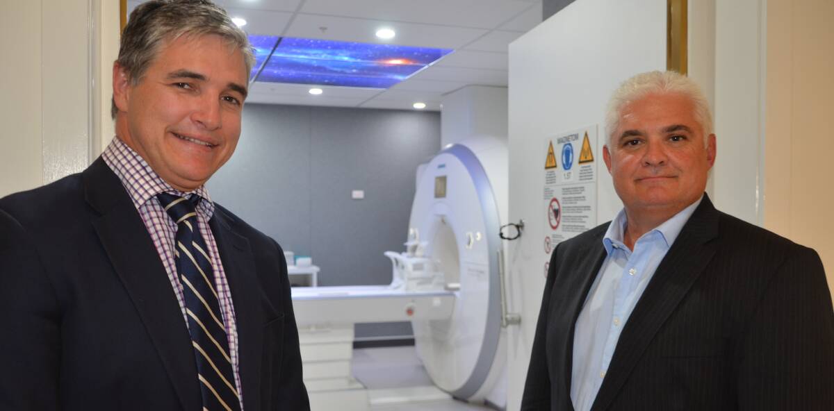 GOOD HEALTH: State member Robbie Katter and I-MED CEO Steven Rubic inspect Mount Isa's new MRI scanner. Photo: Derek Barry