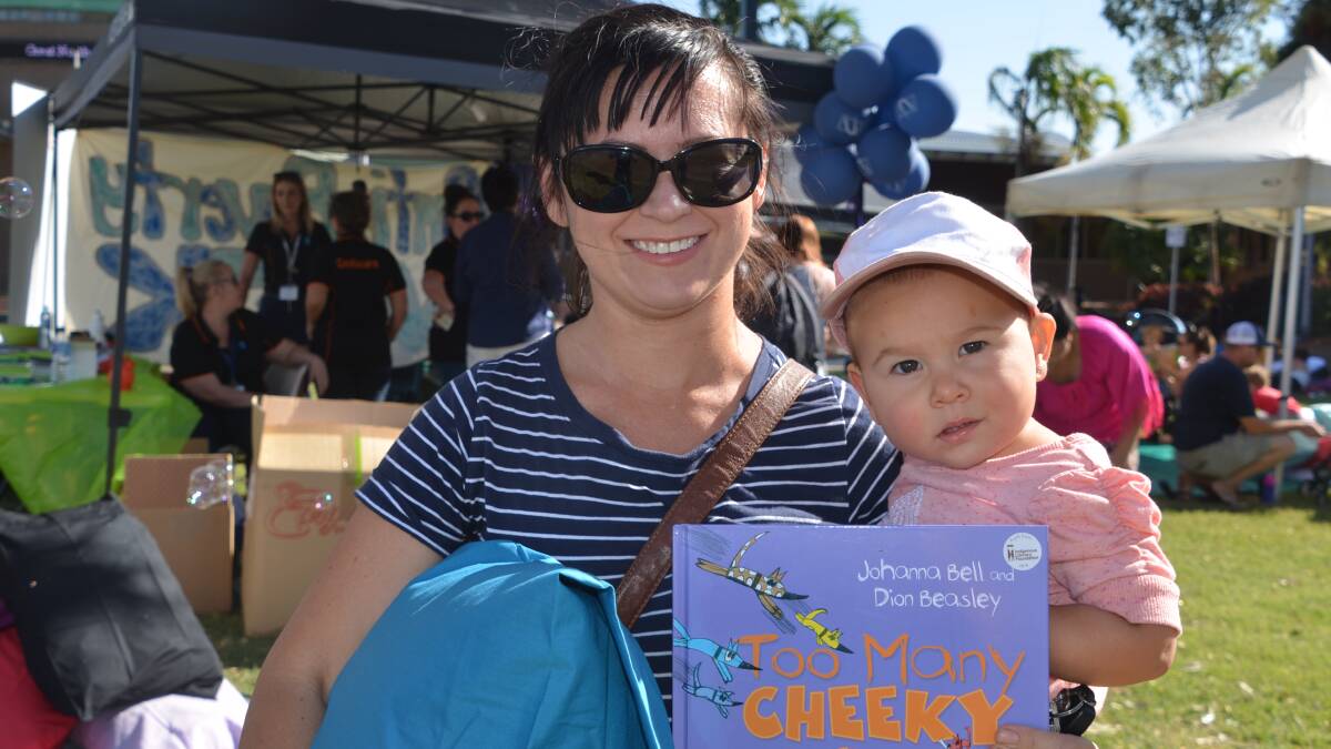 Kate and Ellie Fischer at the literacy event at Mount Isa Civic Centre lawn on Monday.