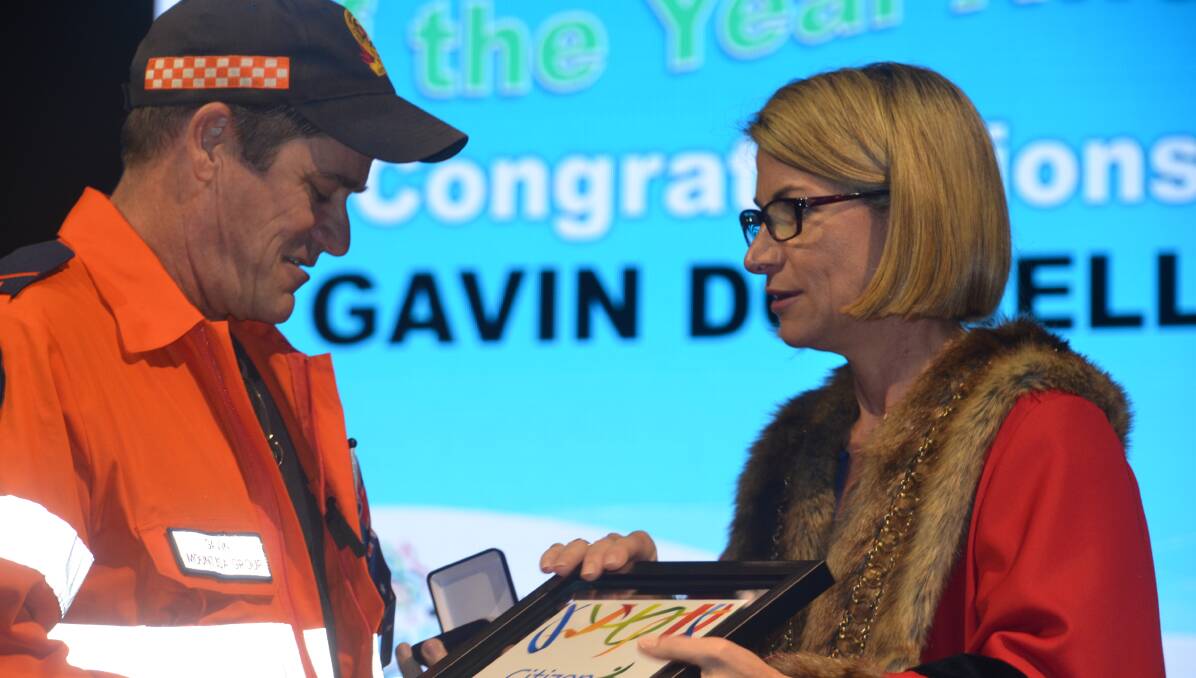 CITIZEN OF THE YEAR: Gavin Donnelly is presented with his Australia Day award by Mayor Joyce McCulloch. Photo: Derek Barry
