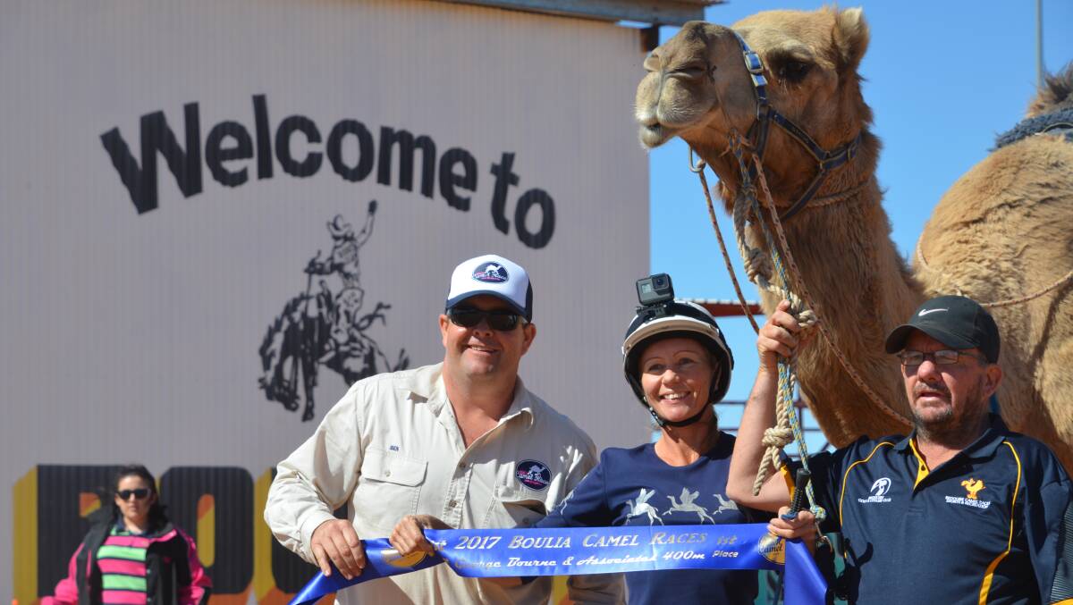 Glenda Sutton celebrates a win at the camel races on her mount Chief on Saturday.