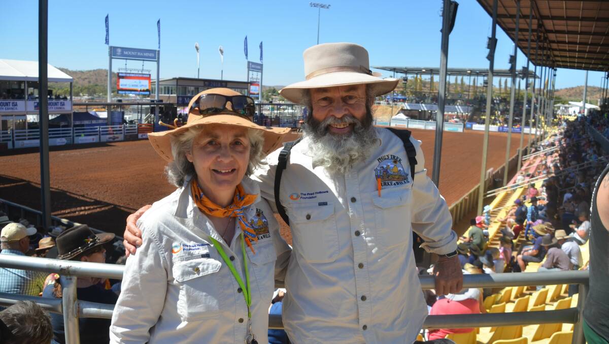 SIDE WALK: Susan and Phil McDonald detour off their Burke & Wills route to take in the action at the Mount Isa Rodeo. Photo: Derek Barry