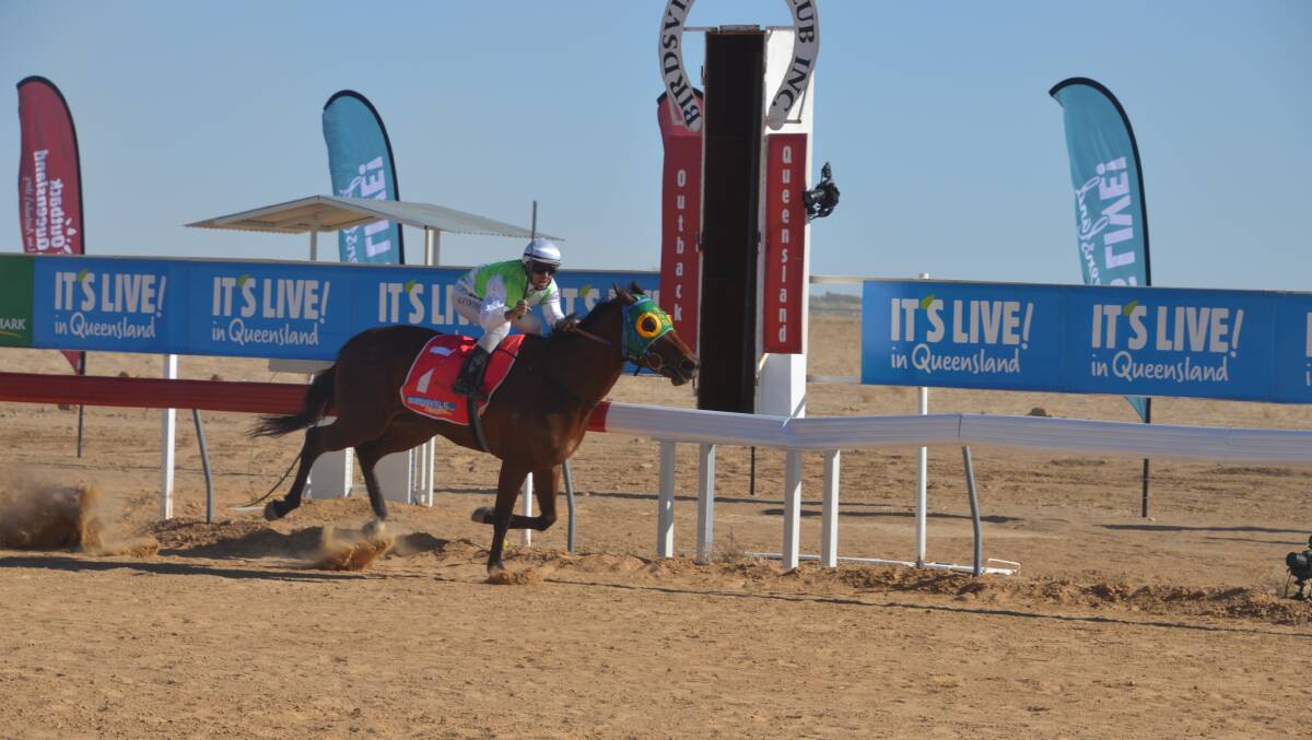 FAST BY NAME: Adrian Coome and the Craig Smith-trained Fast Fella storm clear to win the Birdsville Cup. Photo: Derek Barry