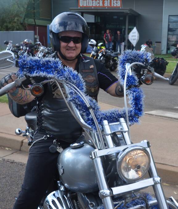 FESTIVE CHEER: Mount Isa Harley Owner Group director Tony Moloney leads the toy run on Saturday. Photo: Derek Barry