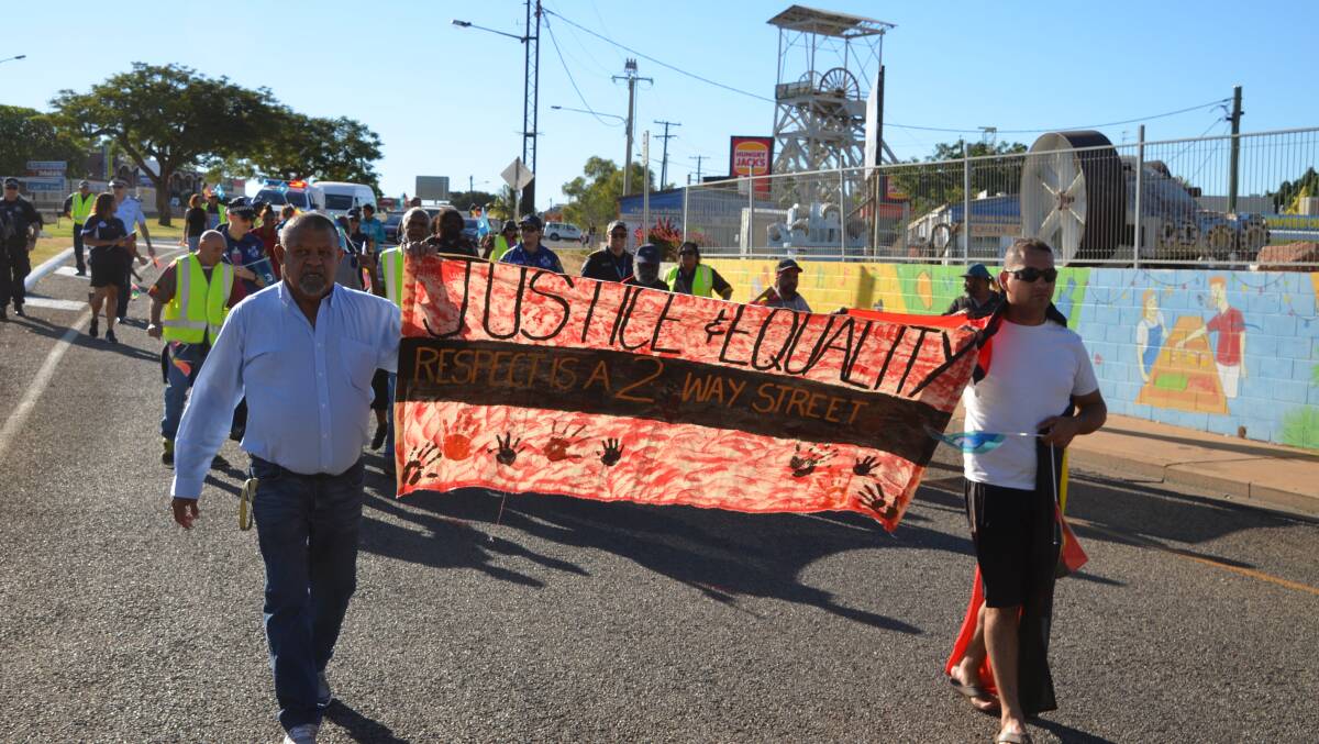 BETTER RELATIONS: Jacob George (left) was one of the organisers of the march through Mount Isa on Saturday. Photo: Derek Barry