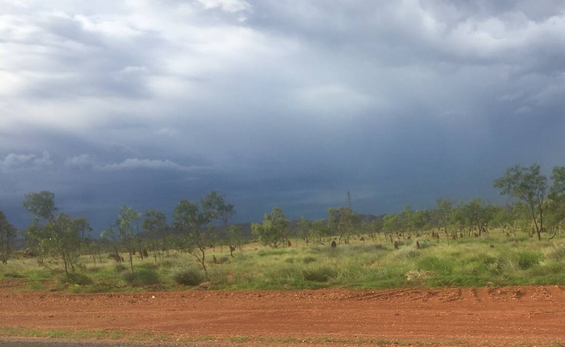 Storm clouds hover over the Barkly Highway between Mount Isa and Cloncurry. Photo: Derek Barry