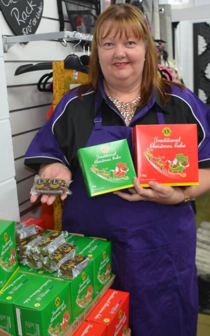 YUMMY YULE: Leichhardt Lions president Lisa Dowler has plenty of Lions Christmas cakes for sale at her Isa Styles shop. Photo: Derek Barry