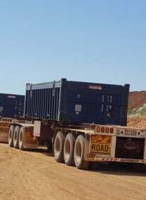 Trucks leave Rocklands carrying containers with copper concentrate.