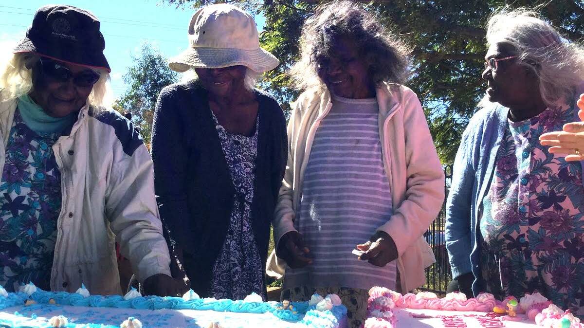 CAKE BAKE: Elders make cakes for the recent Welcome to Country for Doomadgee babies day. See story page 6. Photo:supplied