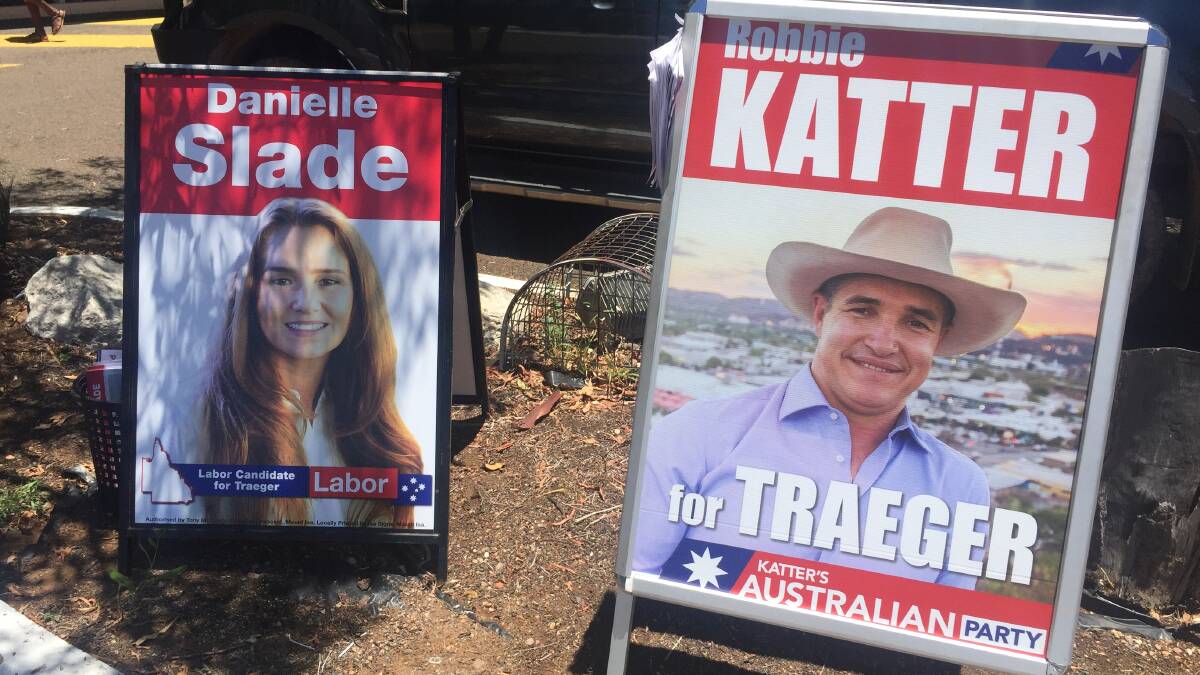 Candidates Danielle Slade and Robbie Katter had posters out in front of the pre-poll centre in Mount Isa.