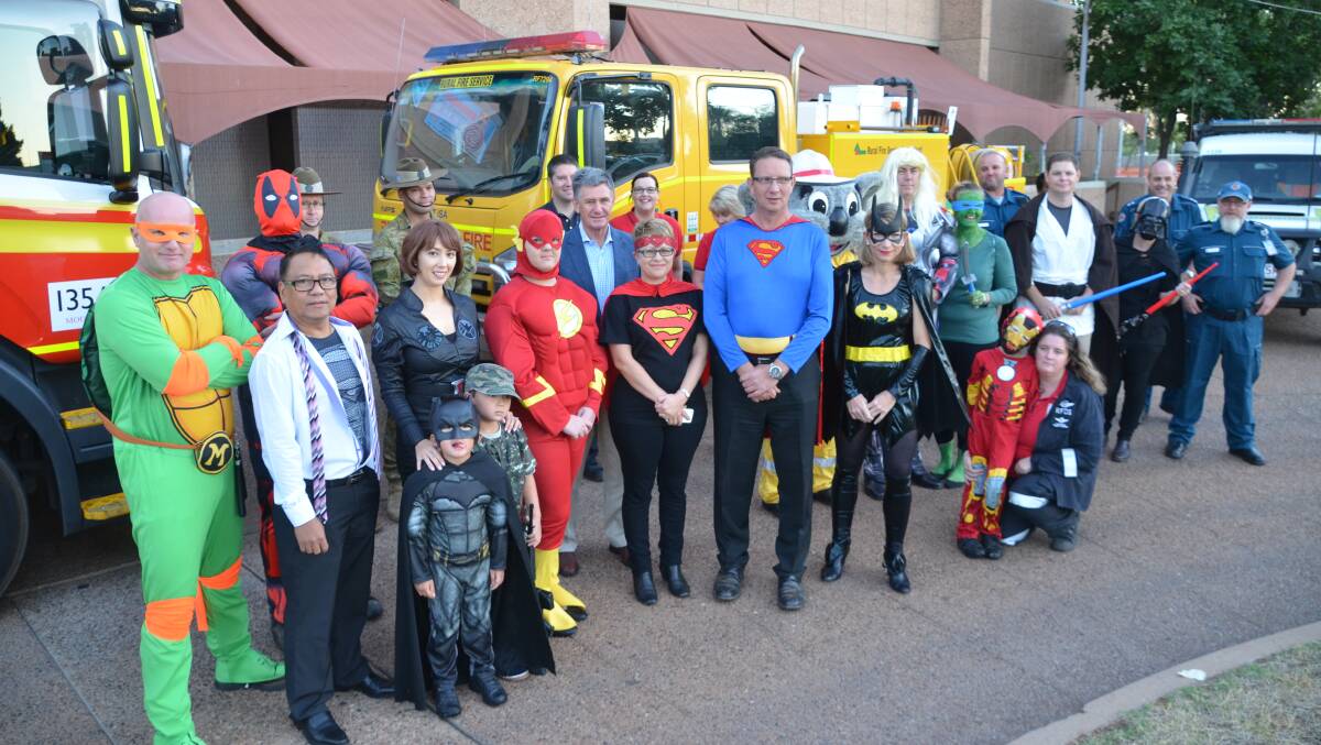 HERO OF THE HOUR: Council leaders and emergency service workers dress up for Super Boss Day at Mount Isa Civic Centre on Friday. Photos: Derek Barry
