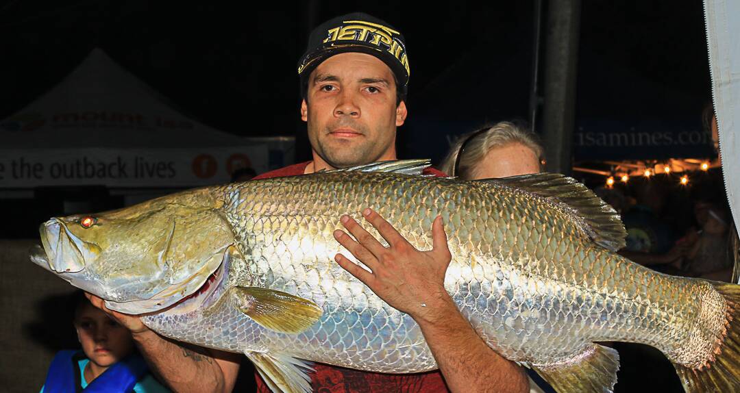A WHOPPER: Joshua Isaacson hooked the biggest barra of the 2015 classic after reeling in this 22.43kg monster. Picture: Michael Hartley Photography