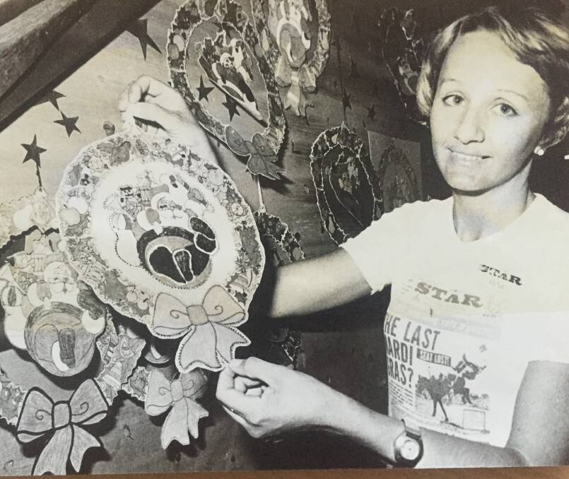 Newspaper staffer Irene Neilsen displays some of the entrants in the Christmas 1977 holding mobile competition run in conjunction with the Star Theatre.