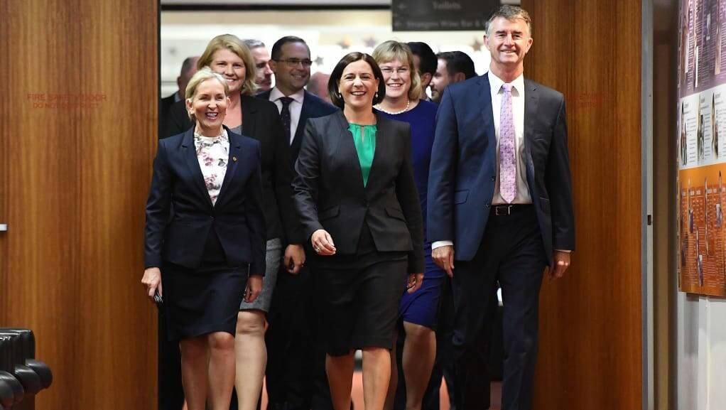 New LNP leader Deb Frecklington (centre) and her new deputy Tim Mander (right) walking in to the party room meeting that saw their elevations.
Photo: Dan Peled/AAP