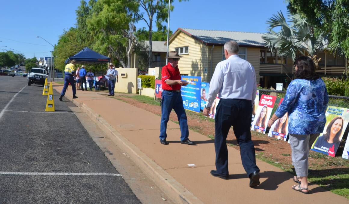 People arrive to vote at Central State School on Saturday.