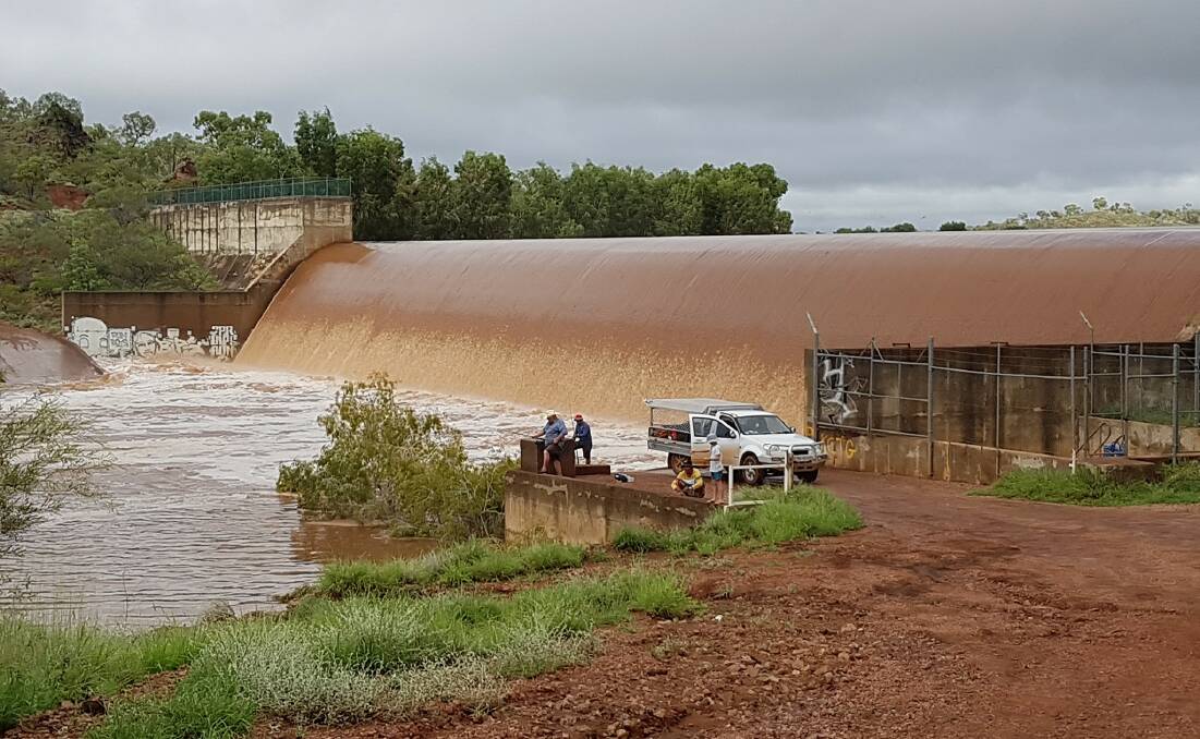 Kaileana Lund sent in this great photo of water flowing over Chinaman Creek Dam Wall in Cloncurry last week.