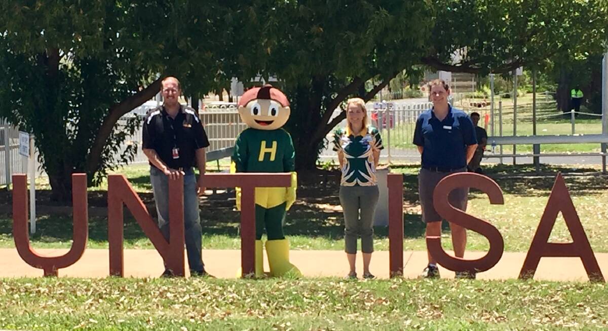 Airport Manager Nigel Rieck, Hurricane Hank the Healy State School Hero, P&C President Megan Crowther and Principal David Hardy at Mount Isa Airport. Photo: contributed