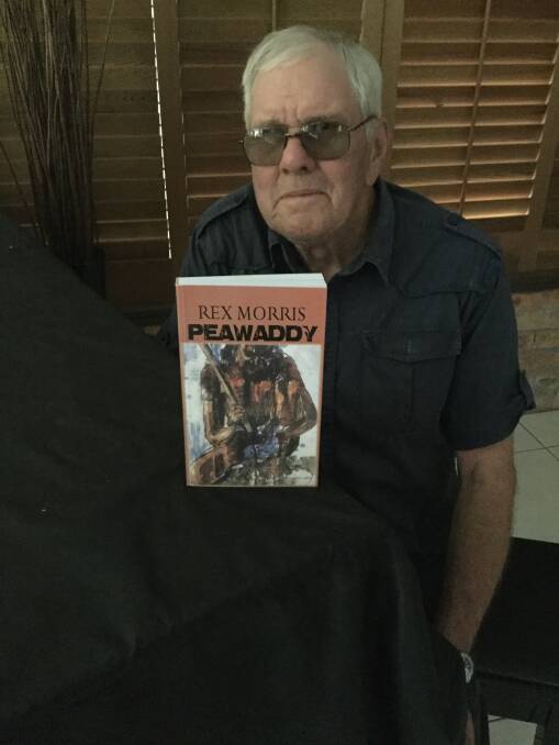 OUT NOW: Rex Morris with a copy of his body Peawaddy, which is set in Queensland frontier times. Photo: contributed