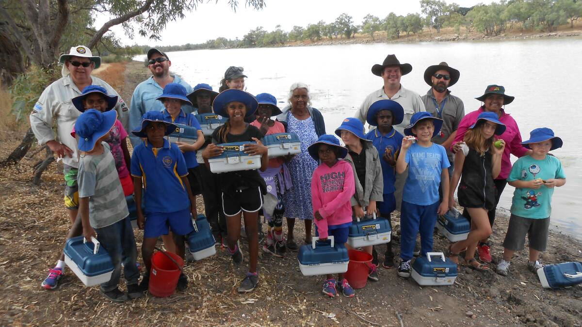 BIG CATCH: Mount Isa Landcare organisers and schoolchildren enjoy a Camooweal Kids Fishing event last month. Photo: supplied.