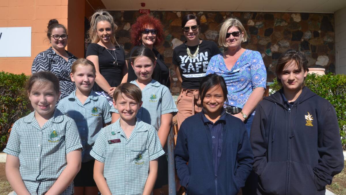 OPTIMINDS: Rotary Club of Mount Isa South West members with students and teachers of Spinifex State College and St Joseph's. Photo: Derek Barry