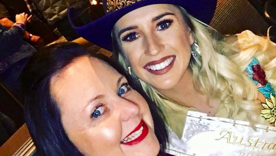 Natalie Flecker and Emma Deicke catch up in Las Vegas where the rodeo is participating in an international convention.