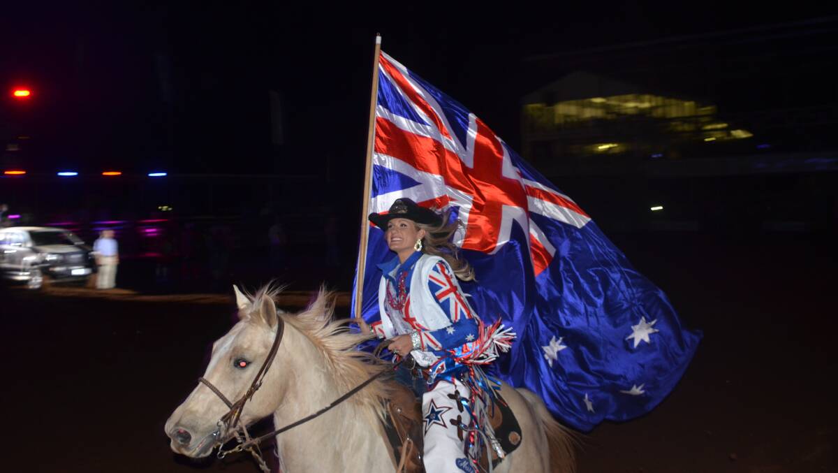 2016 Miss Rodeo Australia Katy Scott enters the arena in last year's Mount Isa Rodeo.