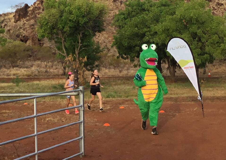 GREEN MACHINE: Steve Chivers braves the hot Australia Day weekend conditions to do the parkrun dressed as a croc.