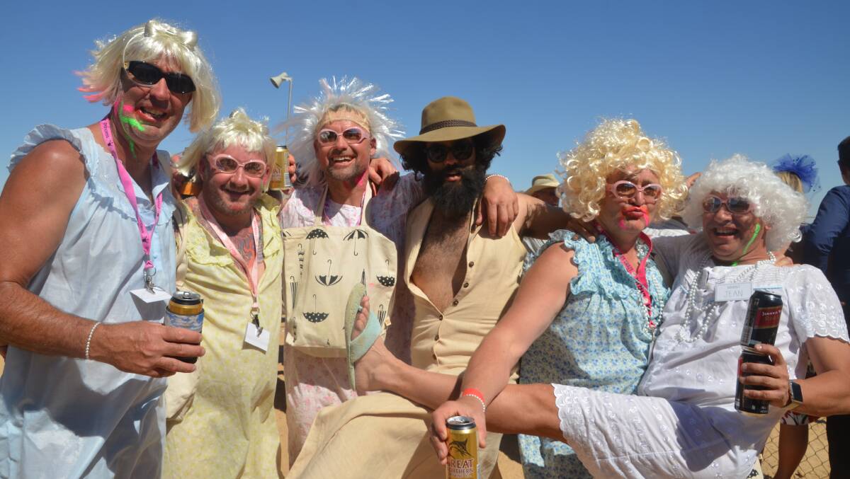 TAKES ALL SORTS: These dubious characters from Victoria whooped it up at Birdsville under the label "Dial A Granny". Photo: Derek Barry