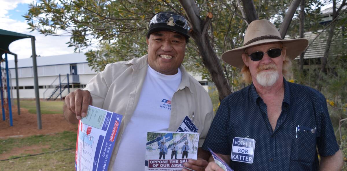 BOB'S BOYS: Carl Olssen and Blue Mayer hand out HTV cards for Bob Katter at Barkly state school in Mount Isa. Photo: Derek Barry