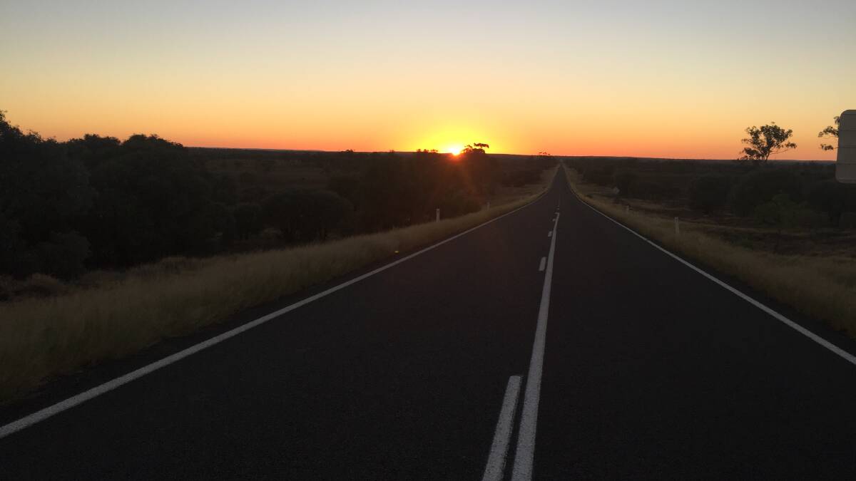 FIRST LIGHT: Editor Derek Barry captured this photo of the sun rising on the Landsborough Hwy on a recent drive from Brisbane to Mount Isa.