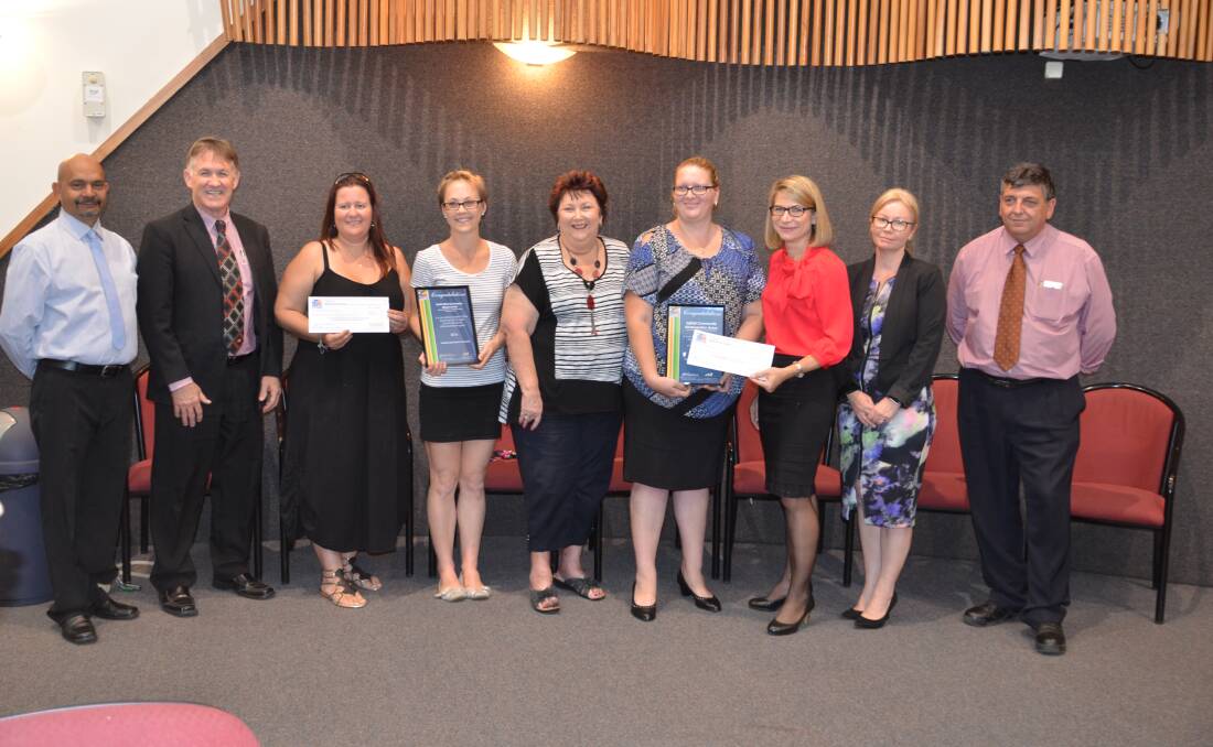 WINNERS: Representatives of North West Gymnastics and Injilinji kindergarten get community grants from Mount Isa City Council. See the Star next week for more details.