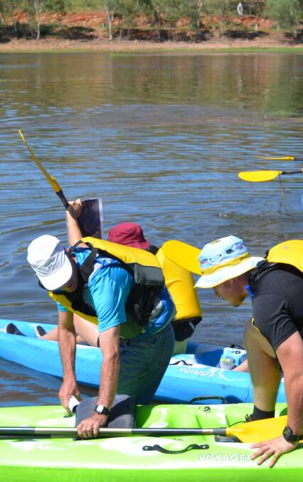 RACE READY: Competitors enter the water in the paddle leg of the Lake Moondarra adventure. Photo Derek Barry
