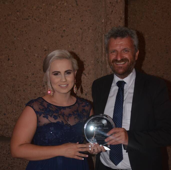 North West Star editor Derek Barry presents Sanctum Media Spa Retreat's Samantha Corlis young business person of the year award for 2017.