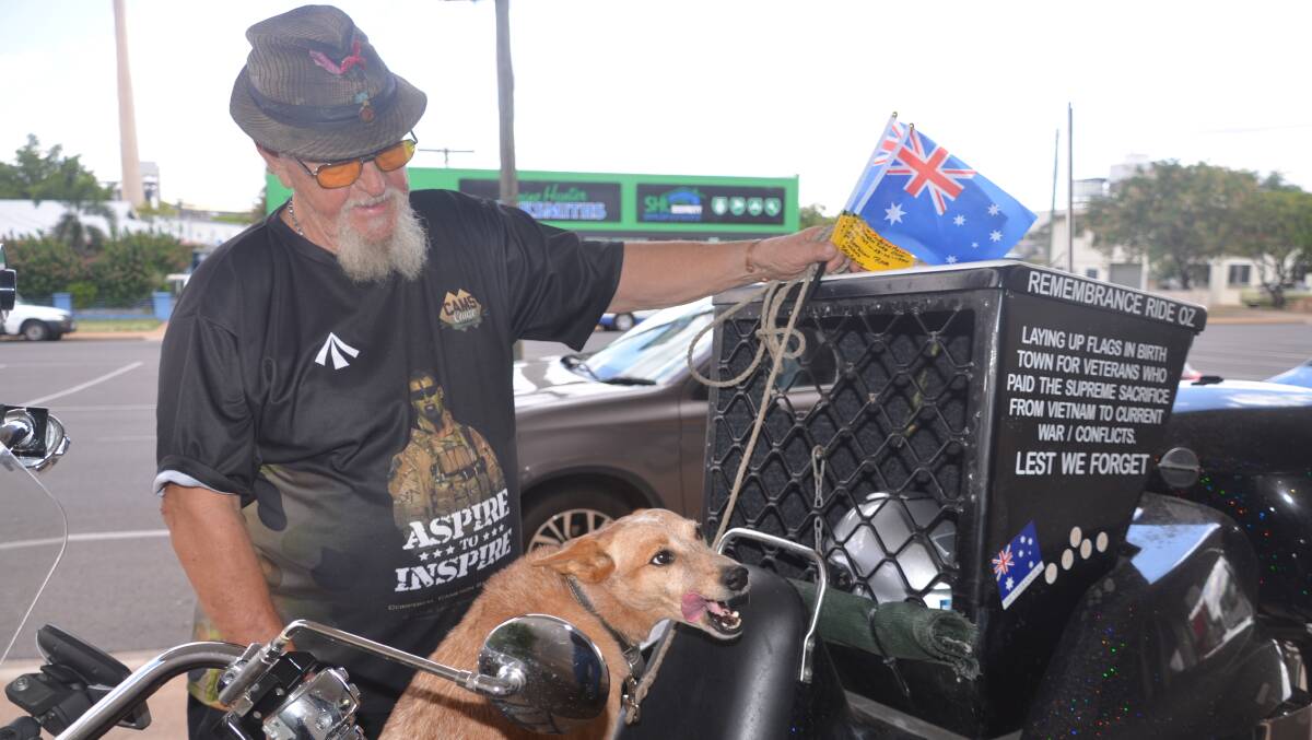 Rob Eade, 71, and dog Ginge are on “Remembrance Ride Oz" and will lay flags at the Cenotaph at 11am Saturday to commemorate the two Mount Isa men who died in the Vietnam war.