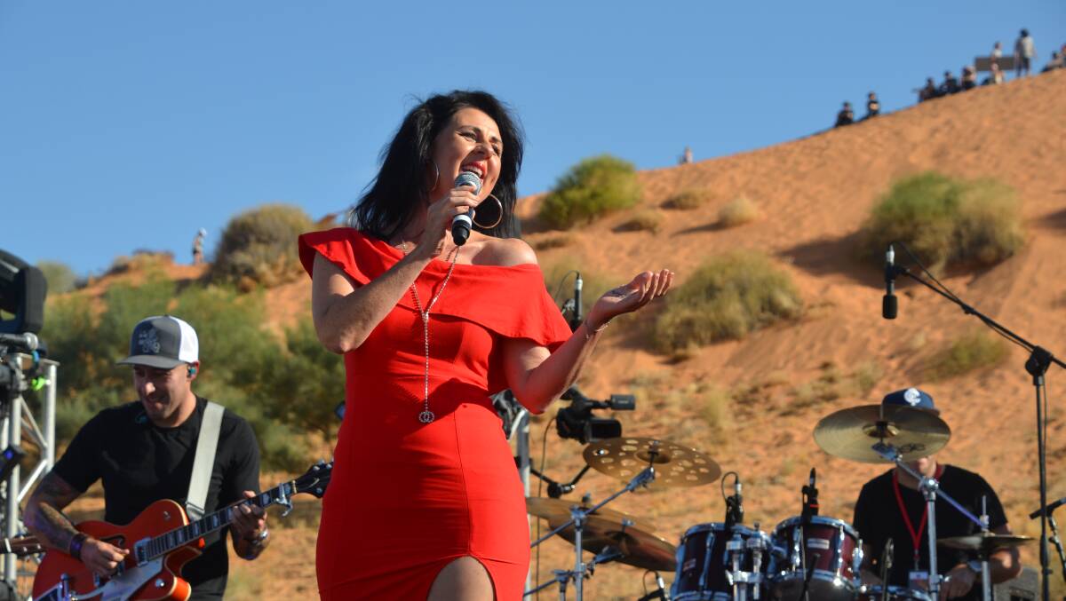 DESERT ISLAND DISC: Tania Kernaghan performs at Big Red backed by the Wolfe Brothers. Photo: Derek Barry