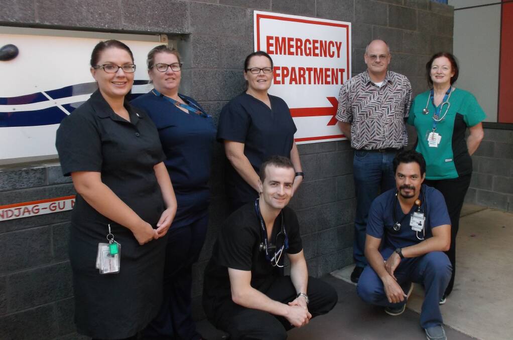 Wishing everyone a merry and safe Christmas and New Year: Members of the Mount Isa 
Hospital emergency department team – from left – Clinical Nurse Sam Mulholland, Clinical Nurse Claire Tonkin, Dr James Allen (crouching), ED Nurse Unit Manager Andrea Wallace, ED Director Dr Ulrich Orda, Dr Zafar Smith (crouching) and Dr Leigh McKenzie.