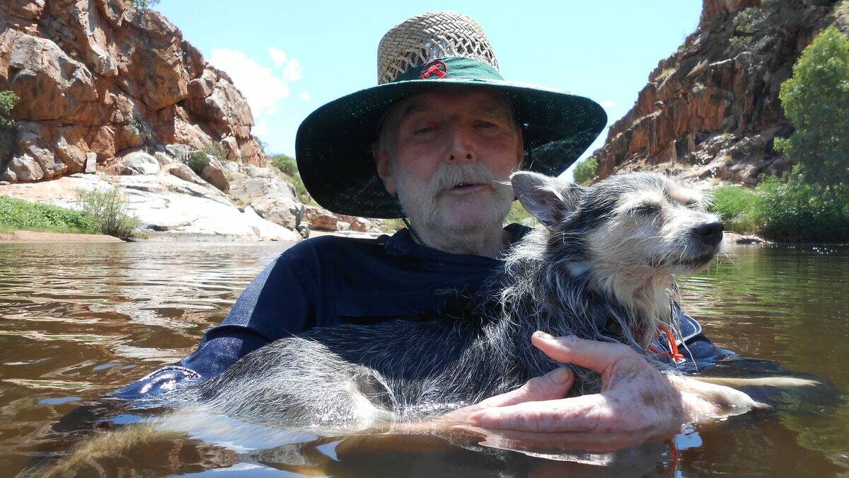 COOL DOWN: Enjoying a well earned swim after a hard day of hunting down belly ache bush are Falcon Seagrave and his dog Nike. Photo: supplied.