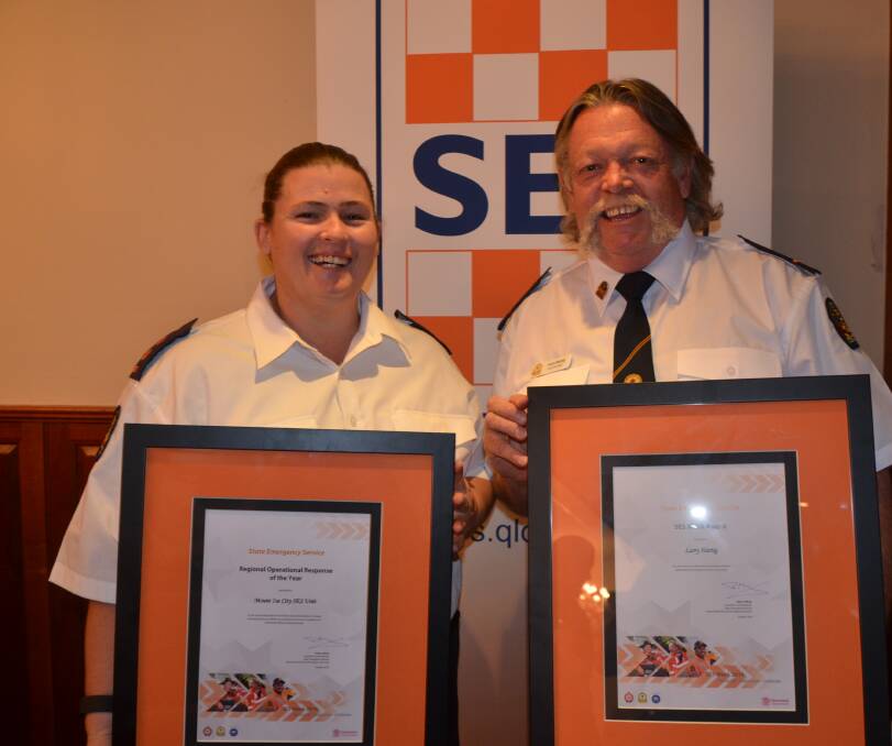 ALL SMILES: Kim Smith accepts an award for Mount Isa SES and Cloncurry SES controller Larry Hartig also won an award. Photo: Derek Barry