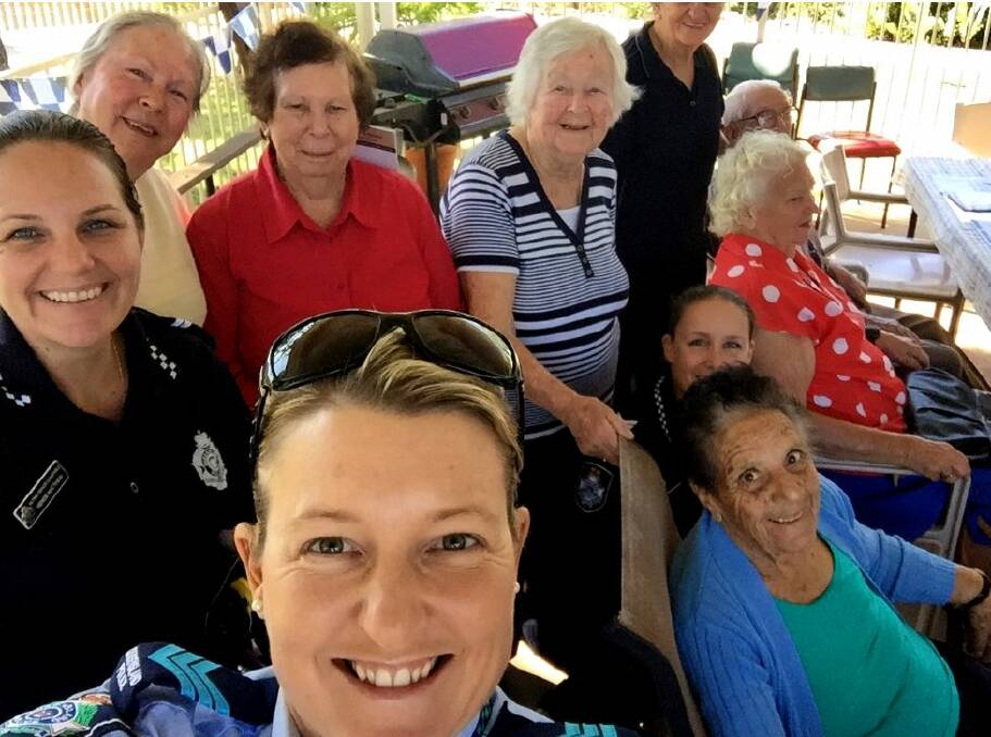 Police selfie with senior citizens at Respite Centre.