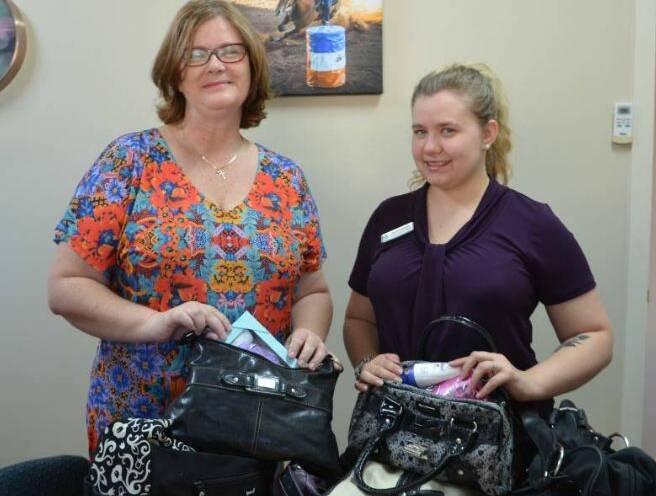 Sue Wicks and Gemma Murphy accept bags filled with goodies last year.