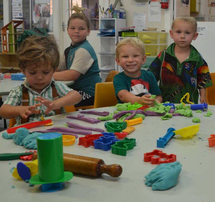 MAKING DOUGH: Kids enjoy play time at the open day on Thursday at Estelle Cardiff Kindergarten in Mount Isa. Photo: Derek Barry