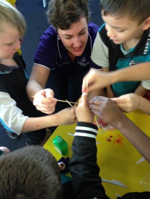 EXPERIMENTAL: Dr Emma Gagen talks science with some of the students at Mount Isa's central State School. Photo: contributed