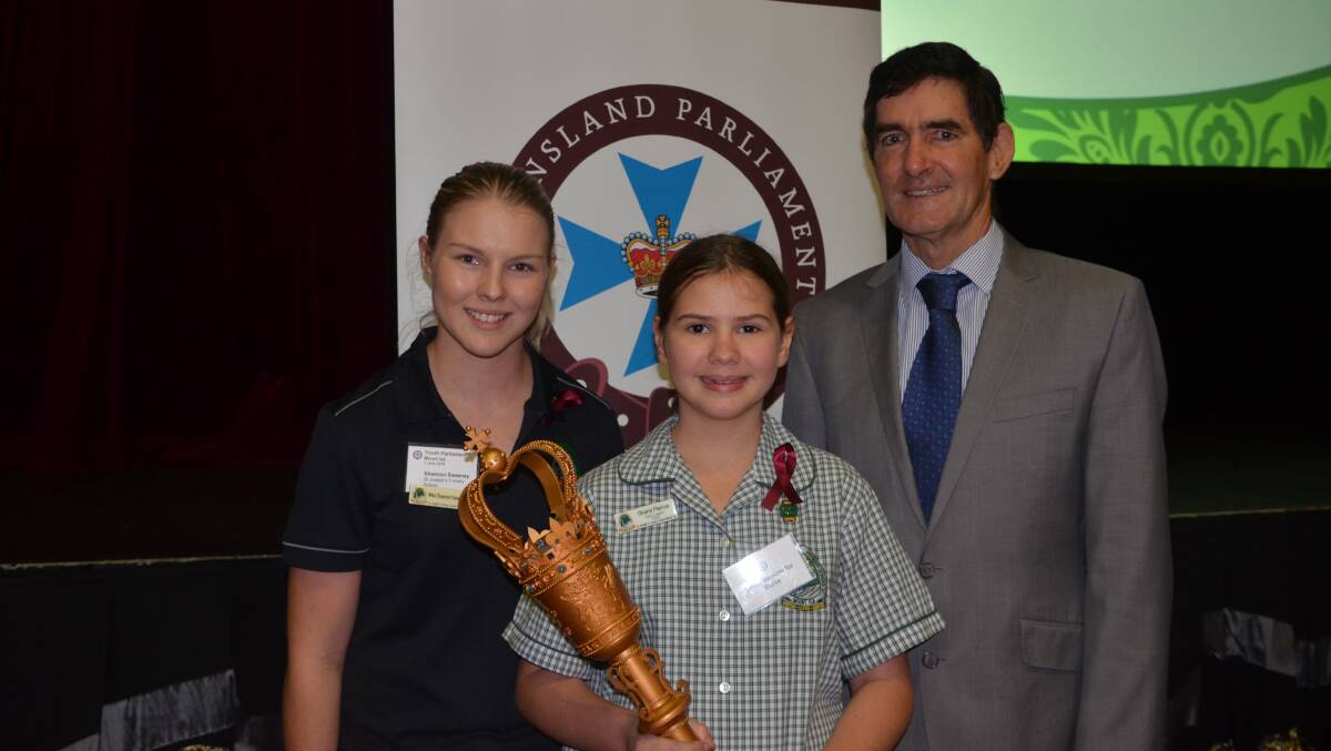St Joseph's teacher Shannon Sweeney, student Sharni Pierce and speaker Peter Wellington at the youth parliament in Mount Isa on Wednesday.