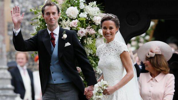 Pippa Middleton and James Matthews smile for the cameras after their wedding at St Mark's Church in Englefield. Photo: AP
