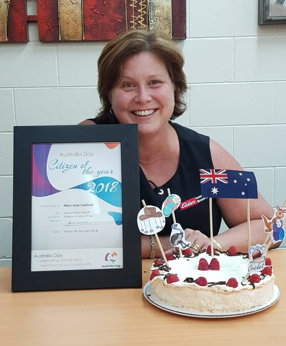 HONOURED: Mary-Jane Caldwell was awarded the Citizen of the Year award as part of Mt Isa's Australia Day celebrations. Mary in the Elders Insurance office.