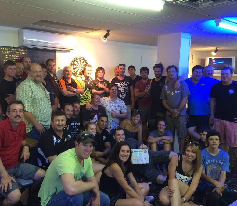 BIG ROLL UP: Players relax after a good night of competition with the Mount Isa Darts Club. Picture: Supplied 