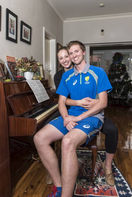 Mike hopes his fiance, Caitlin Higham, will see him play for Australia. Picture: SIMON BAYLISS