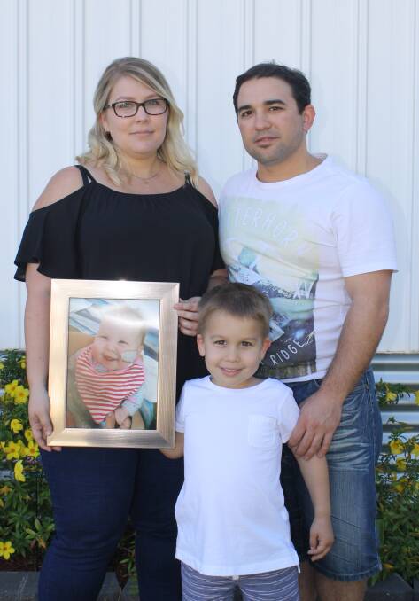 IN MEMORY: Carla, Anthony, and Ashton Busuttil lost their daughter and sister Ariana just last month, but have raised more than $5000 for Mount Isa's children's ward in her memory. Photo: Esther MacIntyre