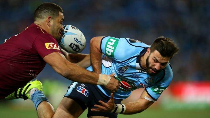 Oops: James Tedesco loses the ball in a tackle by Greg Inglis. Photo: Cameron Spencer